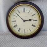 Wooden brass wall clock