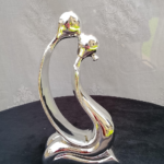 Modern abstract chrome couple sculpture